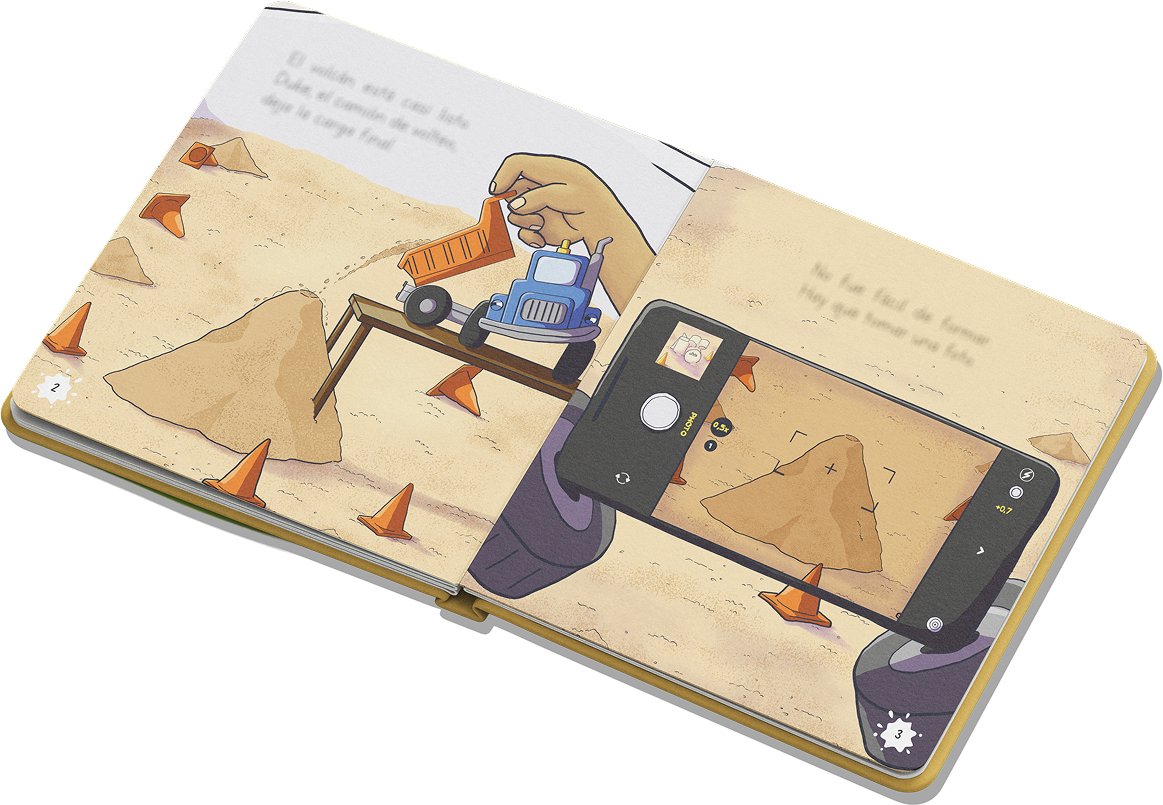 Full-color pages from “El volcán”: in one illustration, a hand holds Duke beside the sand volcano; in the other, Duke takes a photo of the volcano with a phone camera.